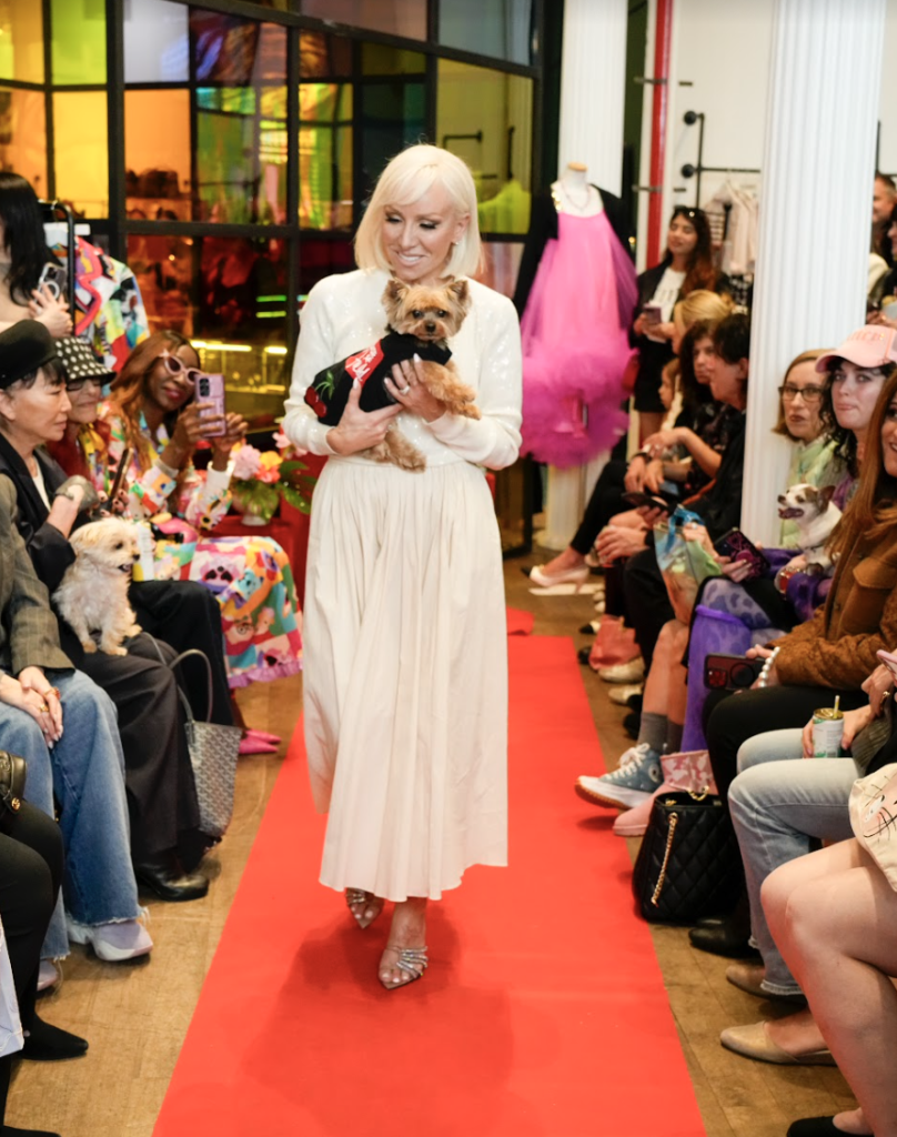 Bravo's RHONJ and co-founder of Soiree, Margaret Joseph walks Charlie's fashion show with her rescue Bella. Photo by Jennifer Graylock-Graylock.com